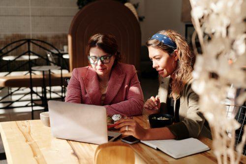 Two women working together at coffee shop