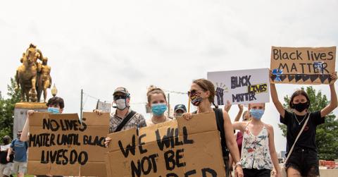 young girls holding signs