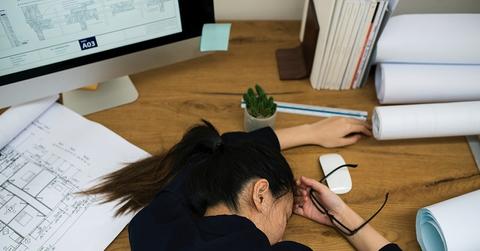 Stressed out woman napping on desk