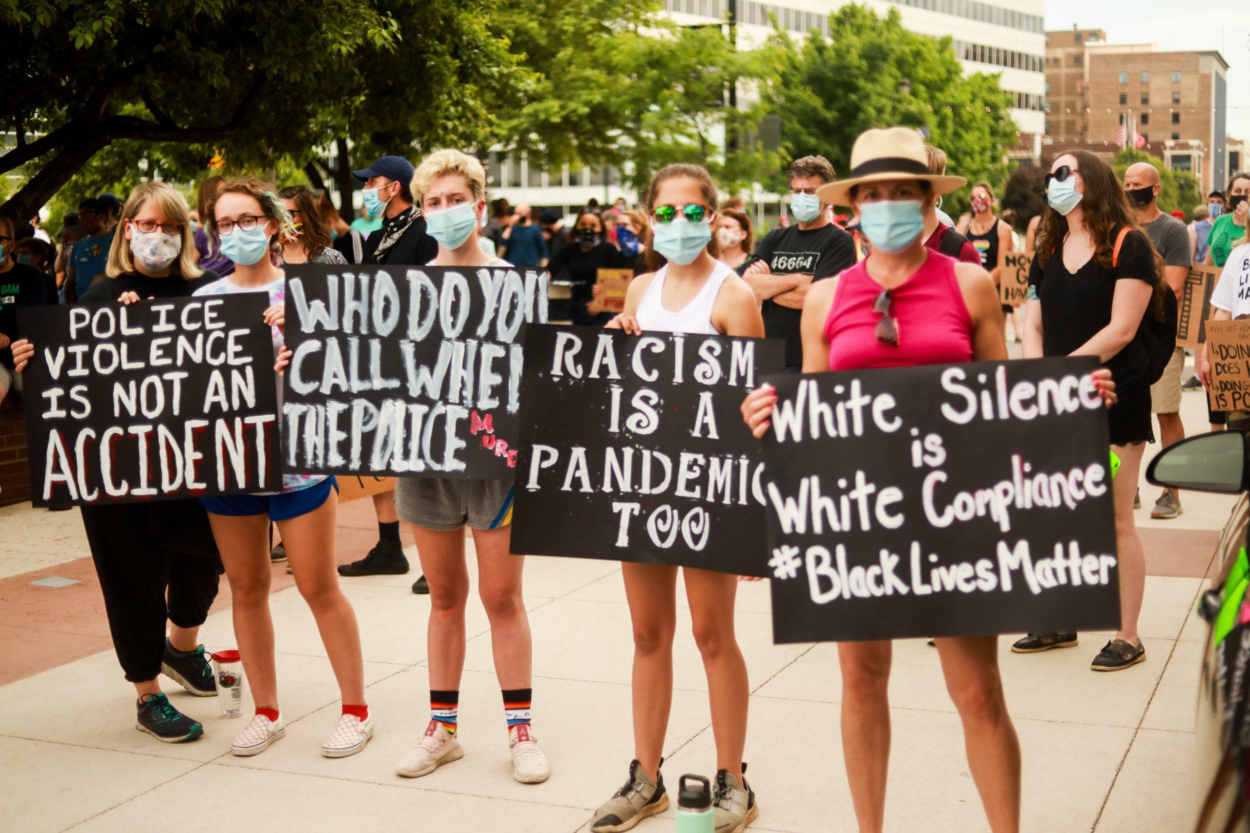 group of women holding signs