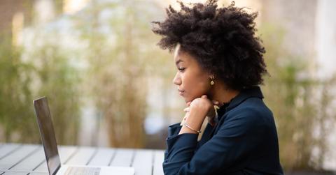 woman outside with laptop
