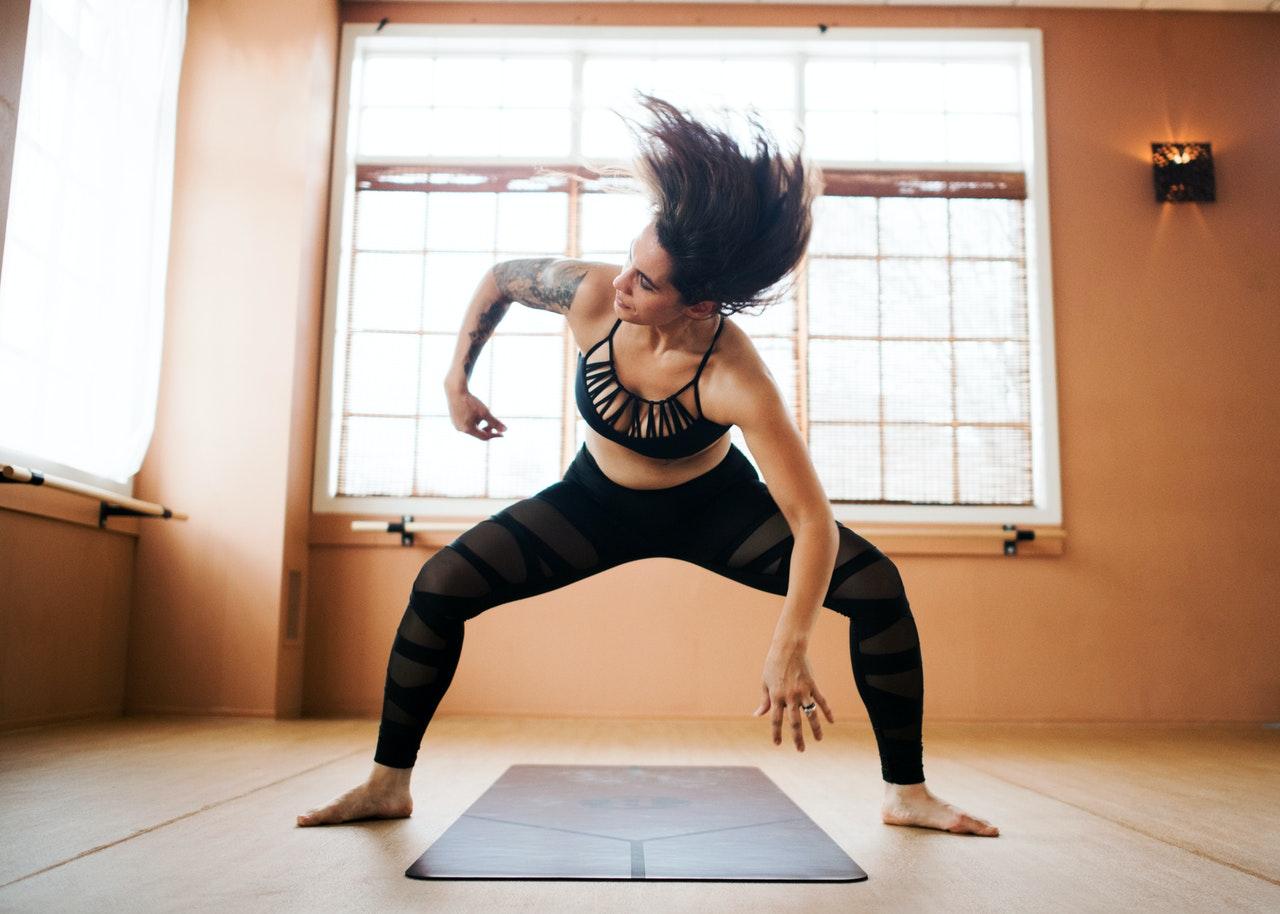 woman doing yoga x