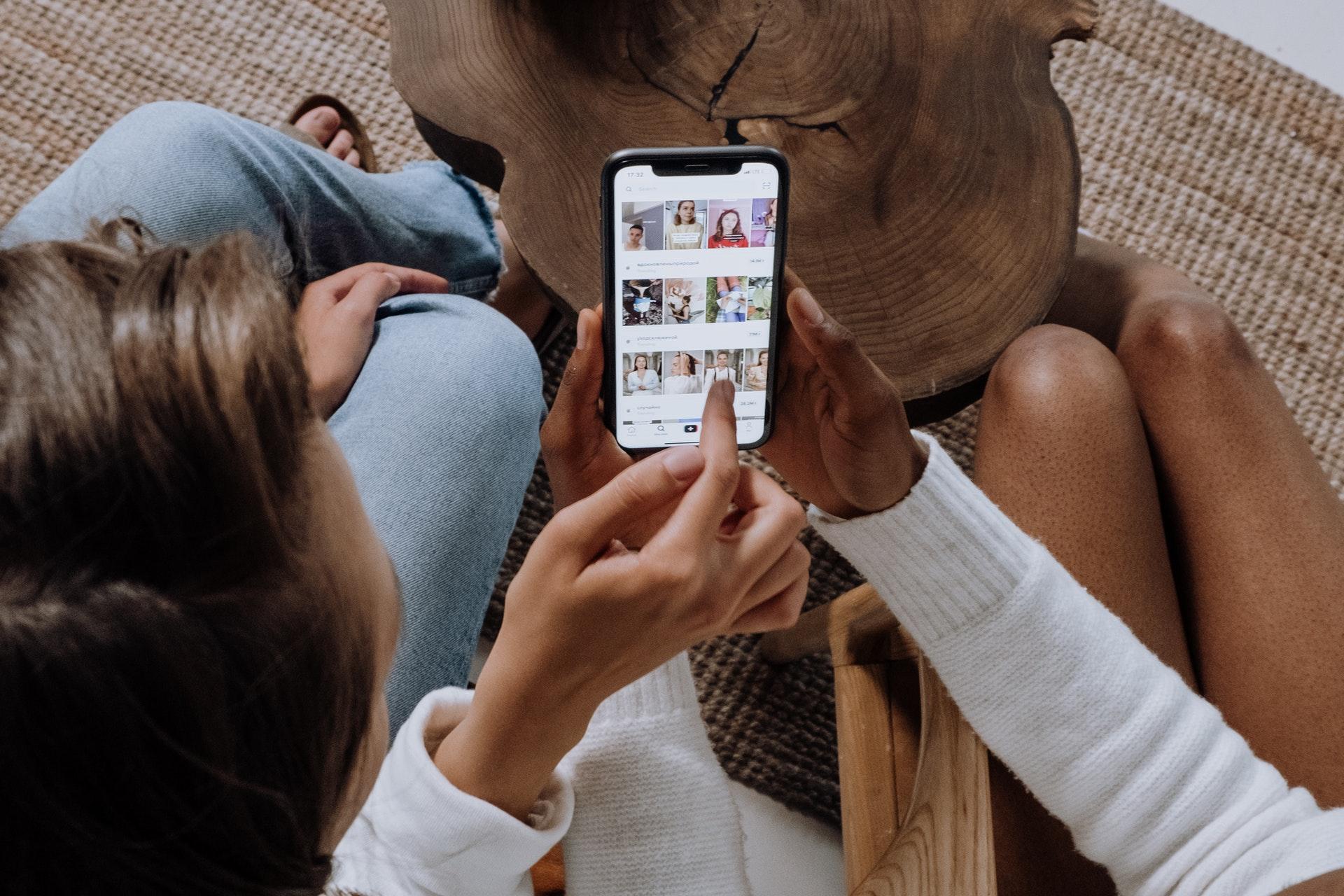 Two women looking at social media