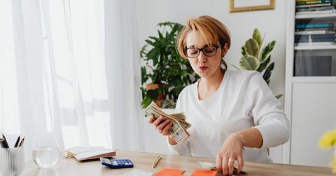 woman holding cash