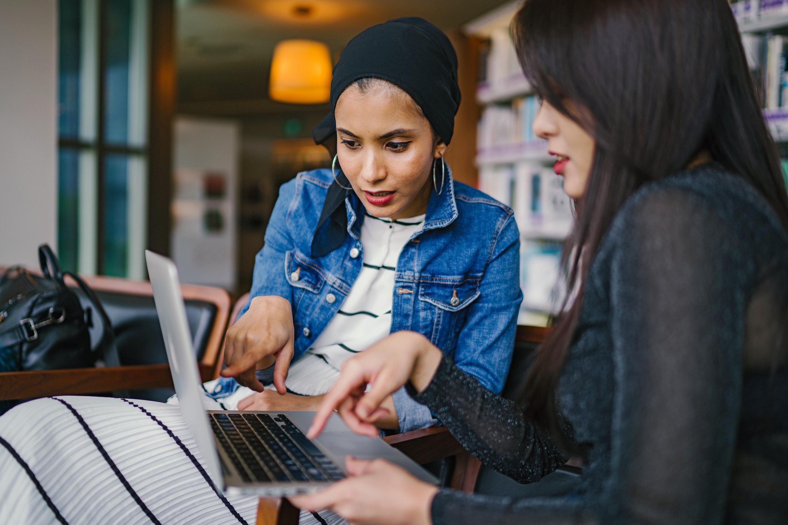 women looking at a laptop