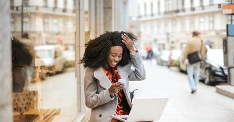 Woman smiling at computer
