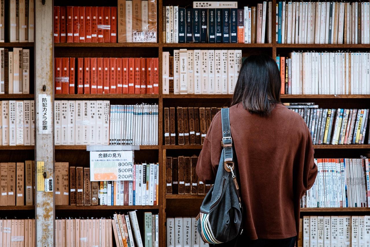 Girl looking at books