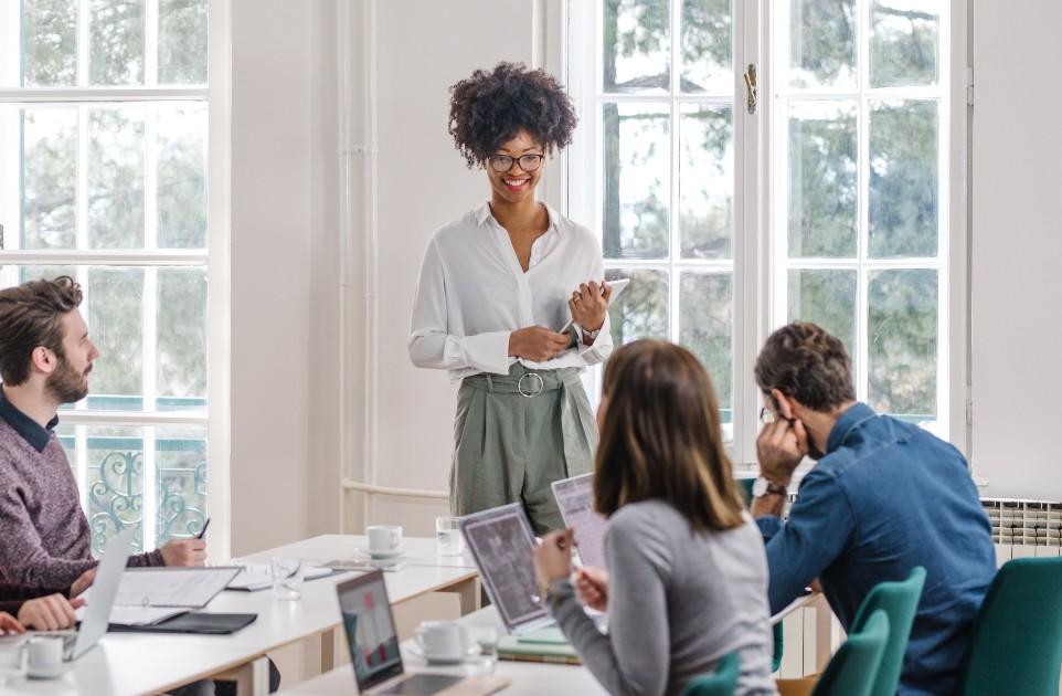 woman in office with team