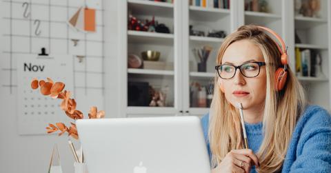 woman thinking at laptop