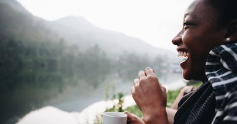 woman drinking coffee outdoors
