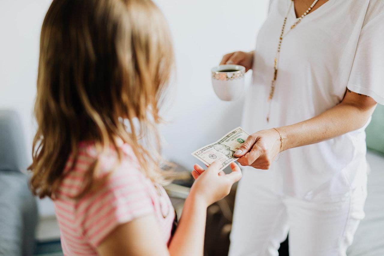 Girl being handed money