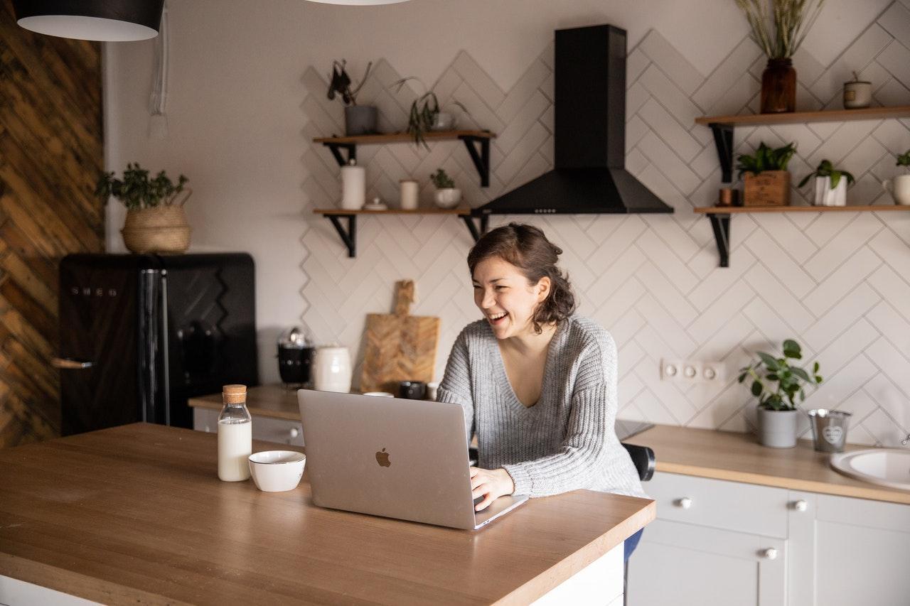 woman smiling at laptop