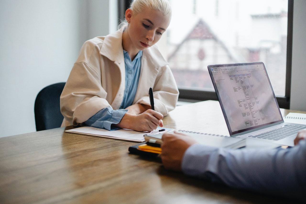 woman signing contract