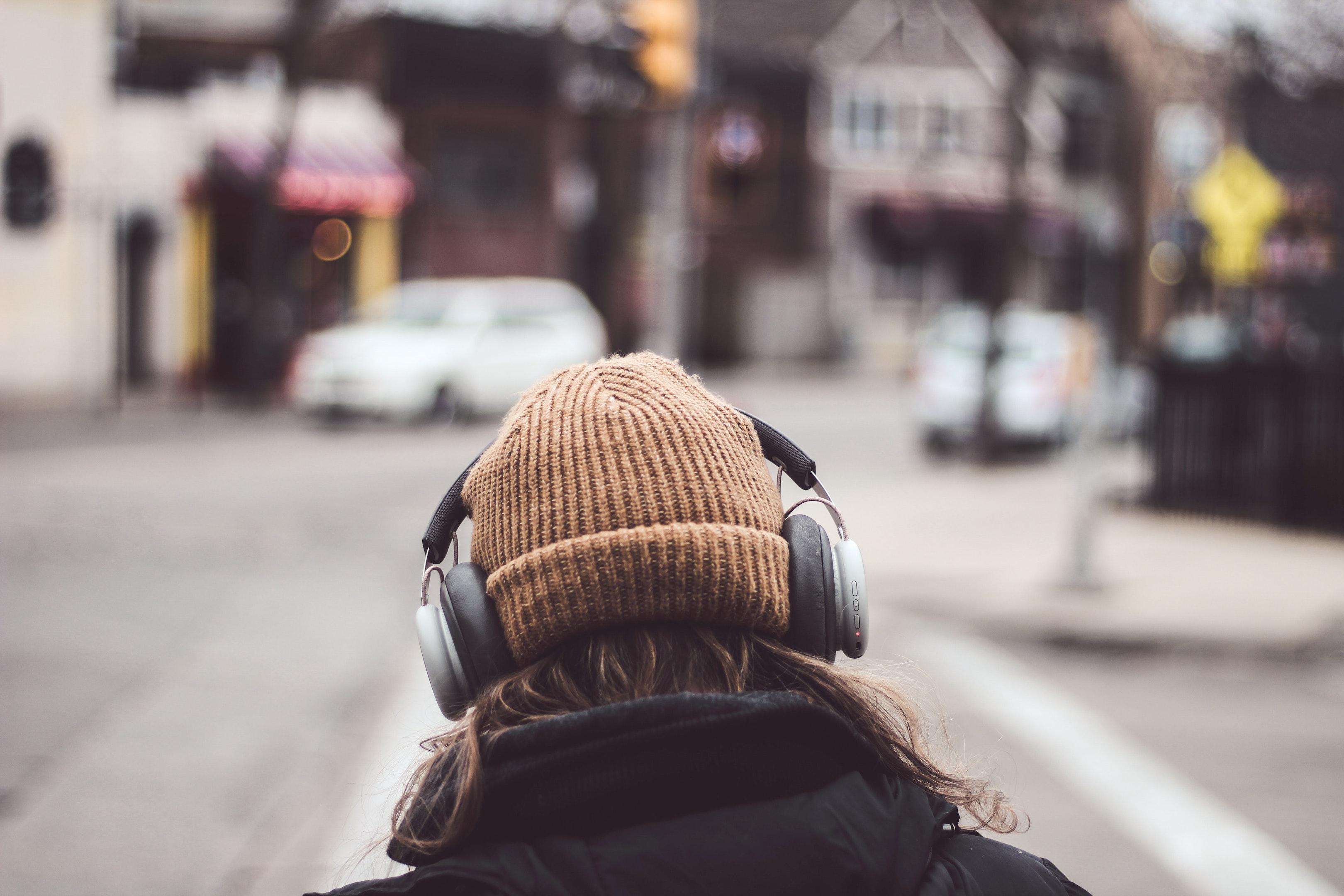 girl headphones walking