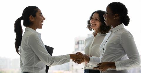 women shaking hands