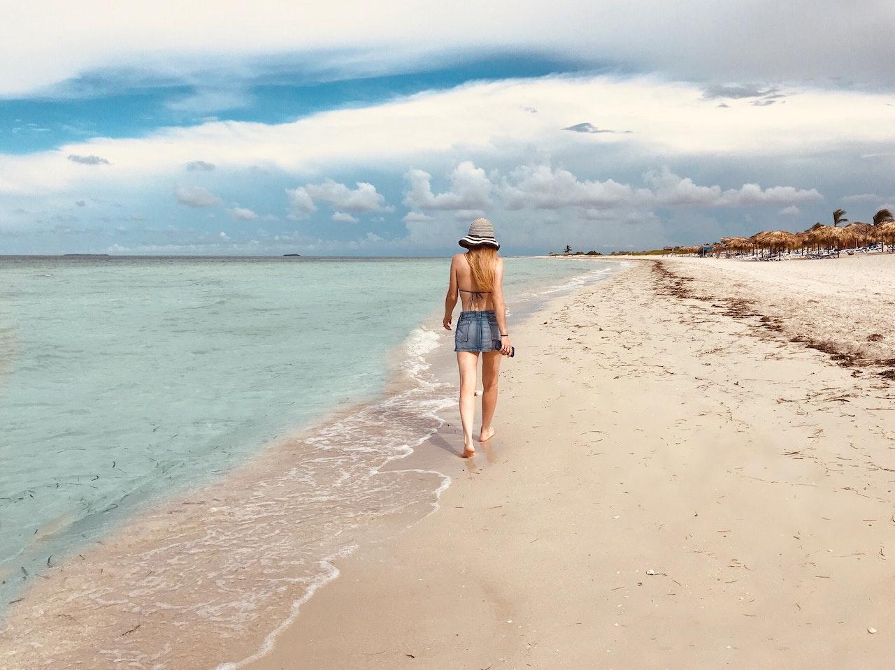 woman alone on beach in fall