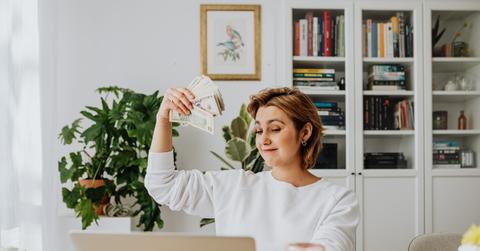 woman holding cash