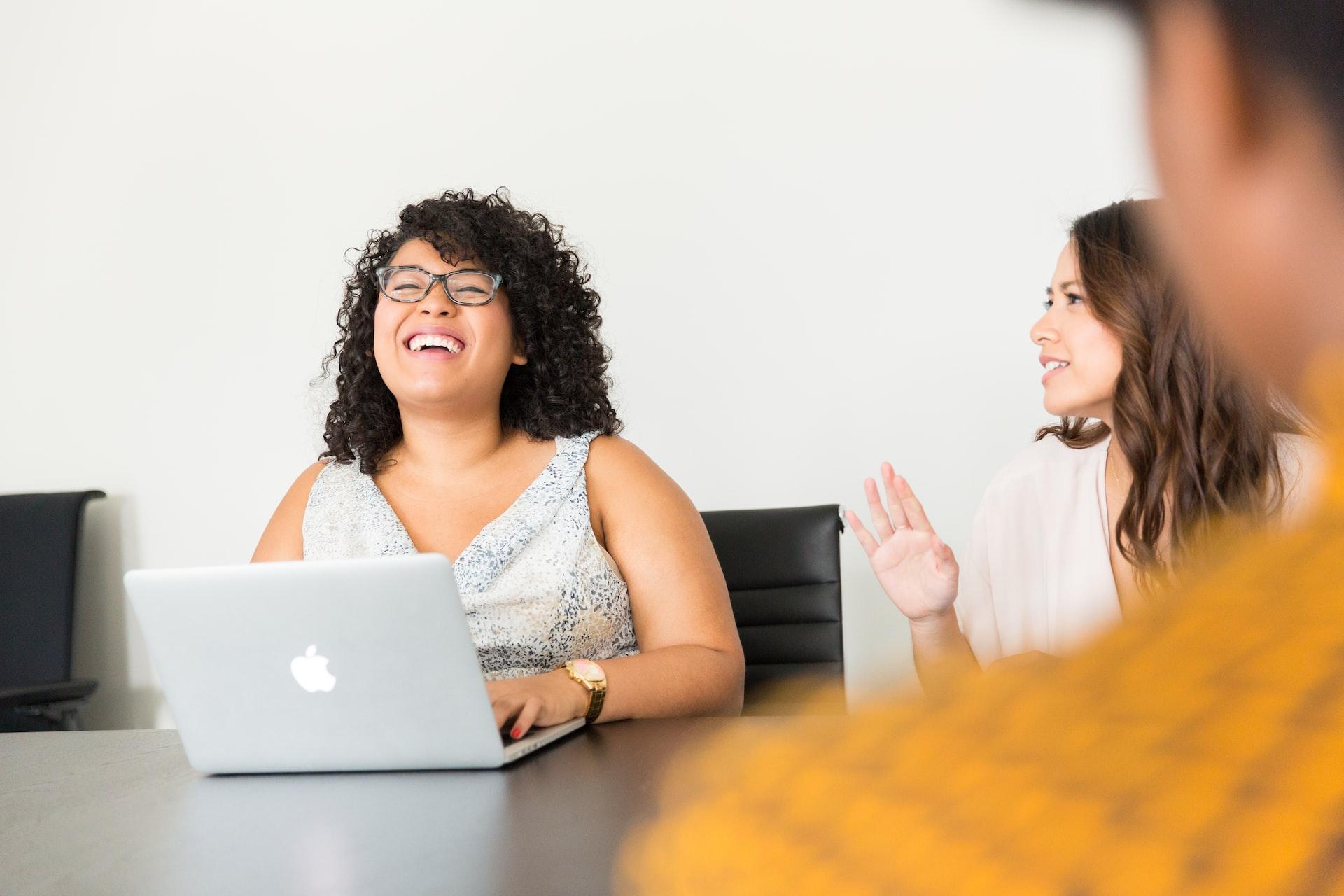 Woman laughing at work