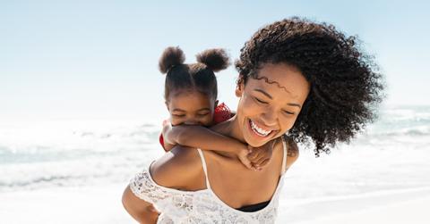 woman with child on beach
