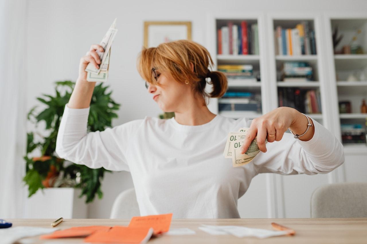 woman holding cash