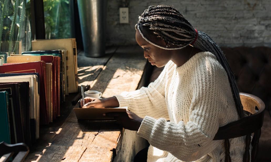 woman writing in journal