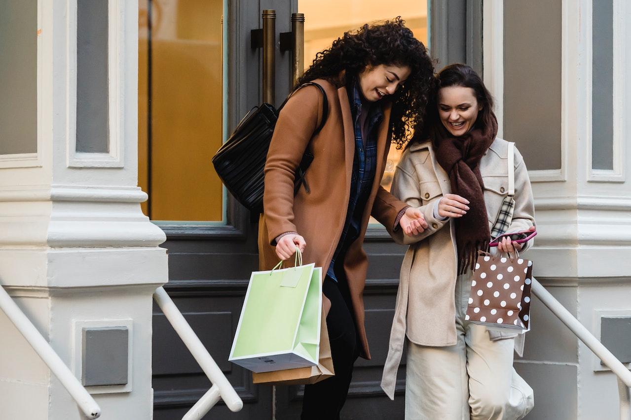 Two customers leaving store