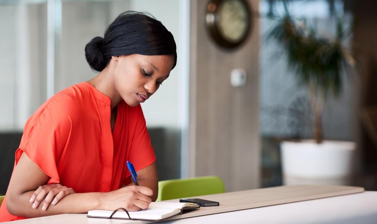 woman writing resolutions