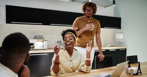 Woman laughing at work