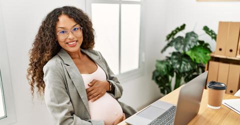 pregnant millennial at work