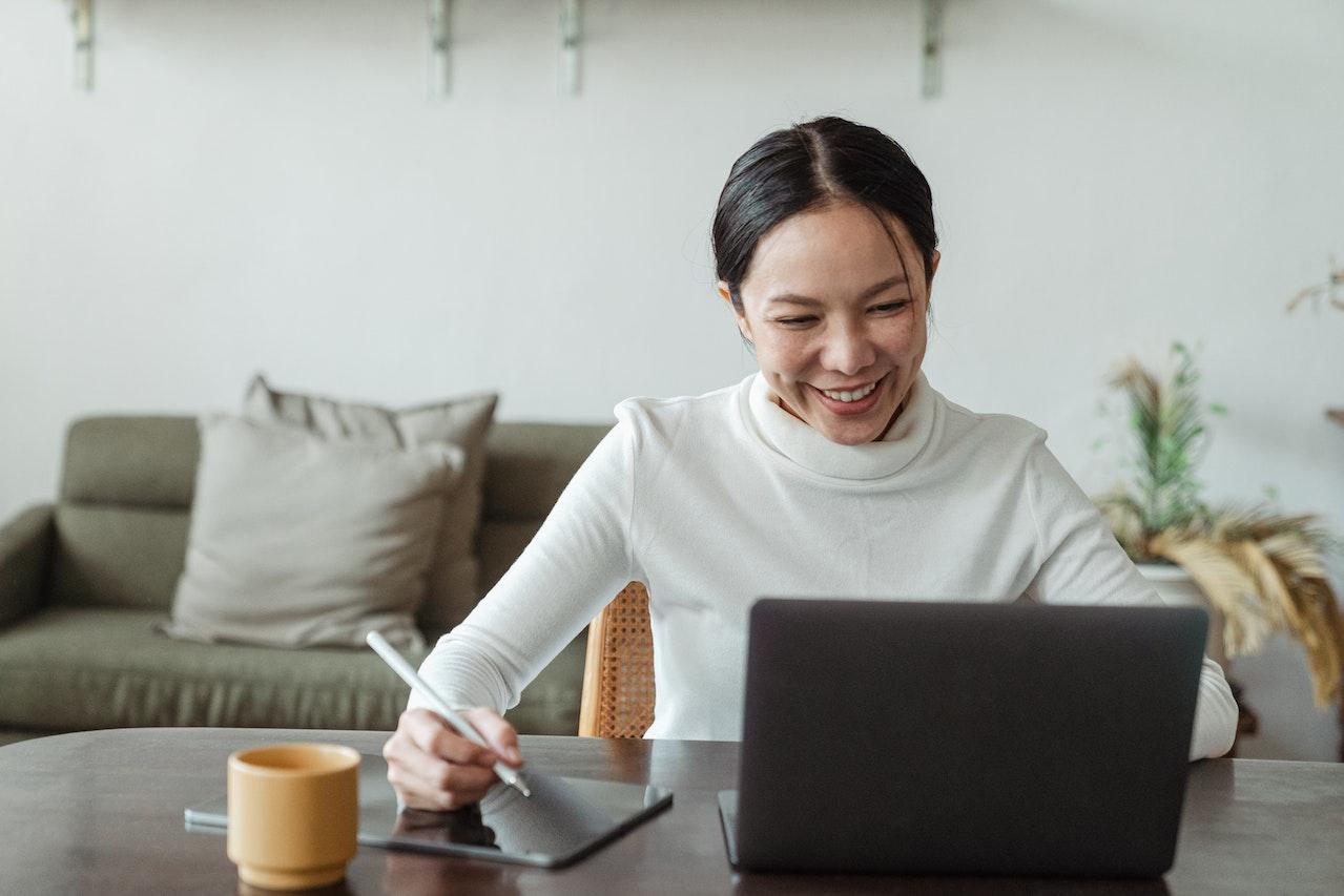 happy woman at laptop