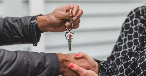 Person Holding Silver Key