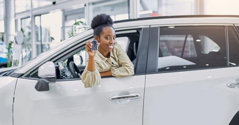 Woman in new car