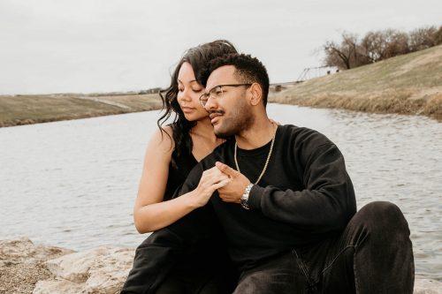 man and woman holding hands in black