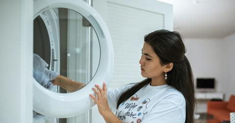 woman at laundry machine