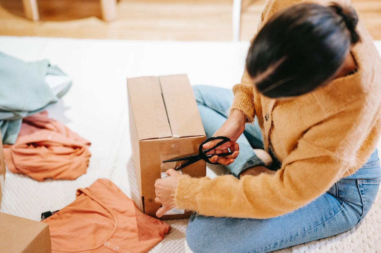 Woman boxing up clothes