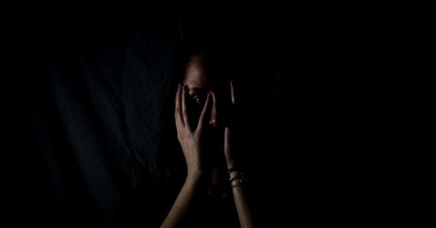 woman hiding her face