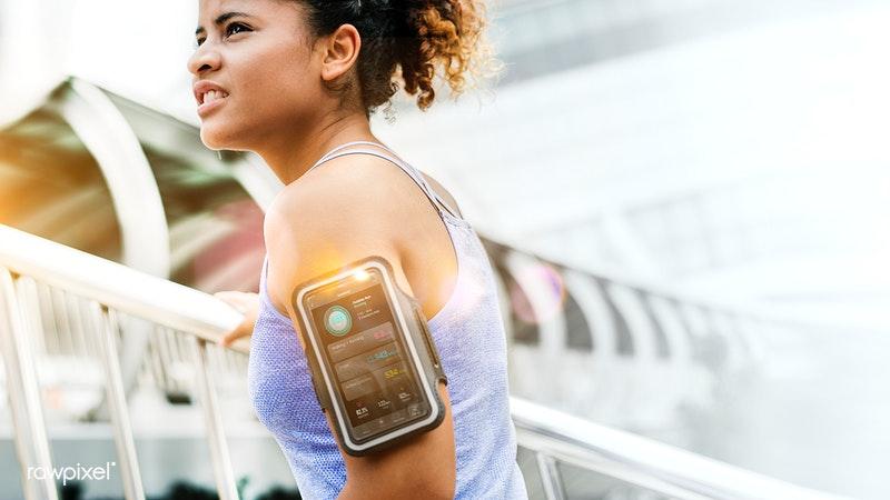 Girl with a fitness tracker on arm