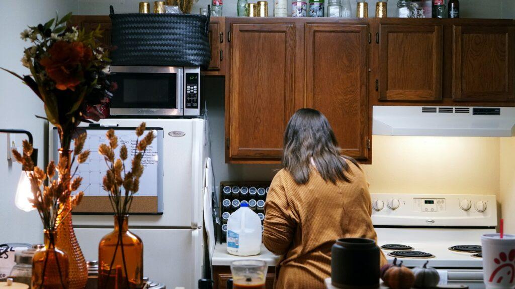 Woman cooking in her kitchen 