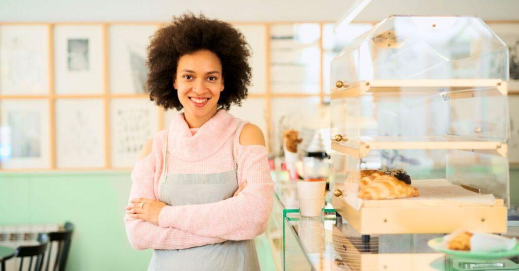 female bakery owner posing in a bakery shop