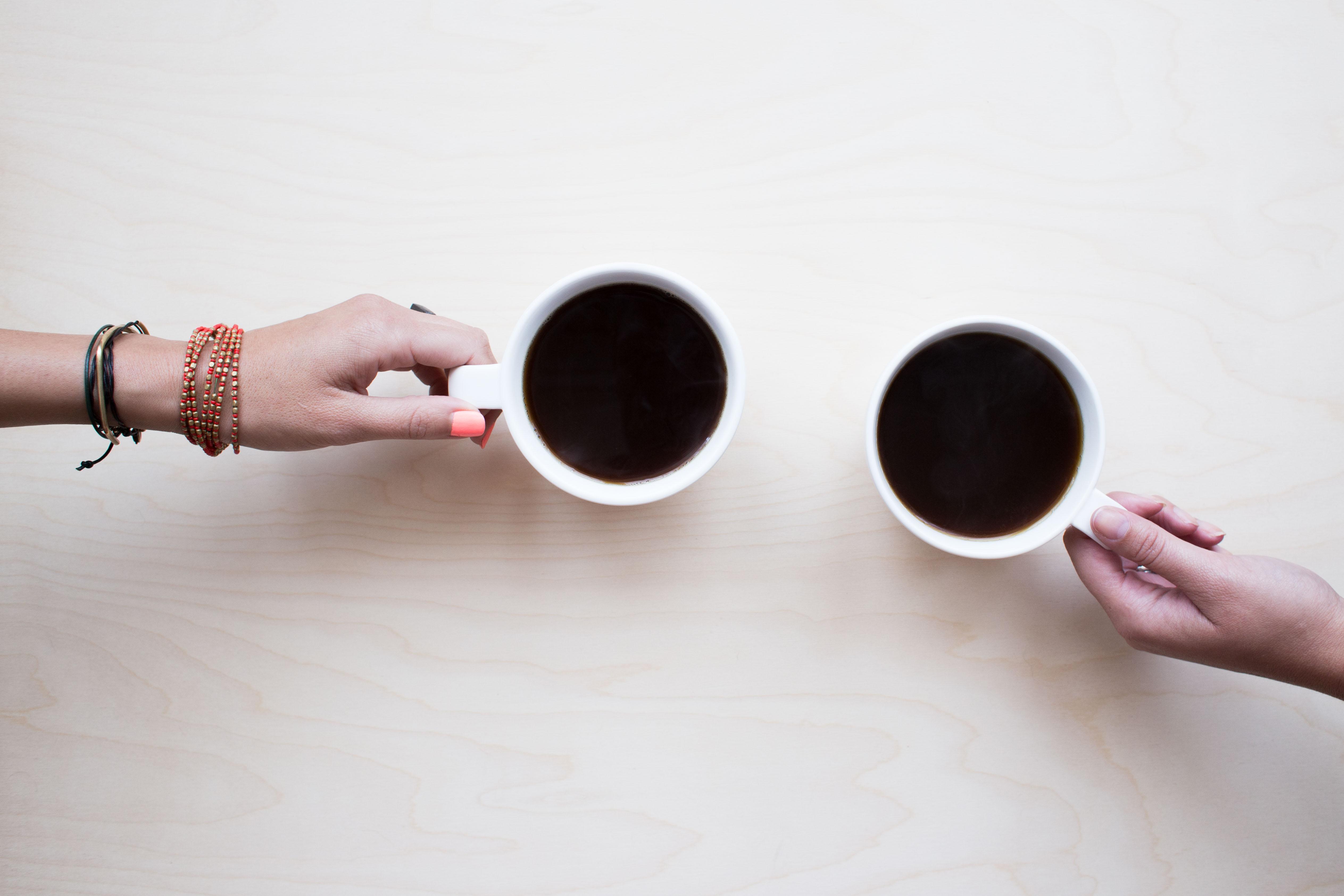 Mentor and mentee with coffee