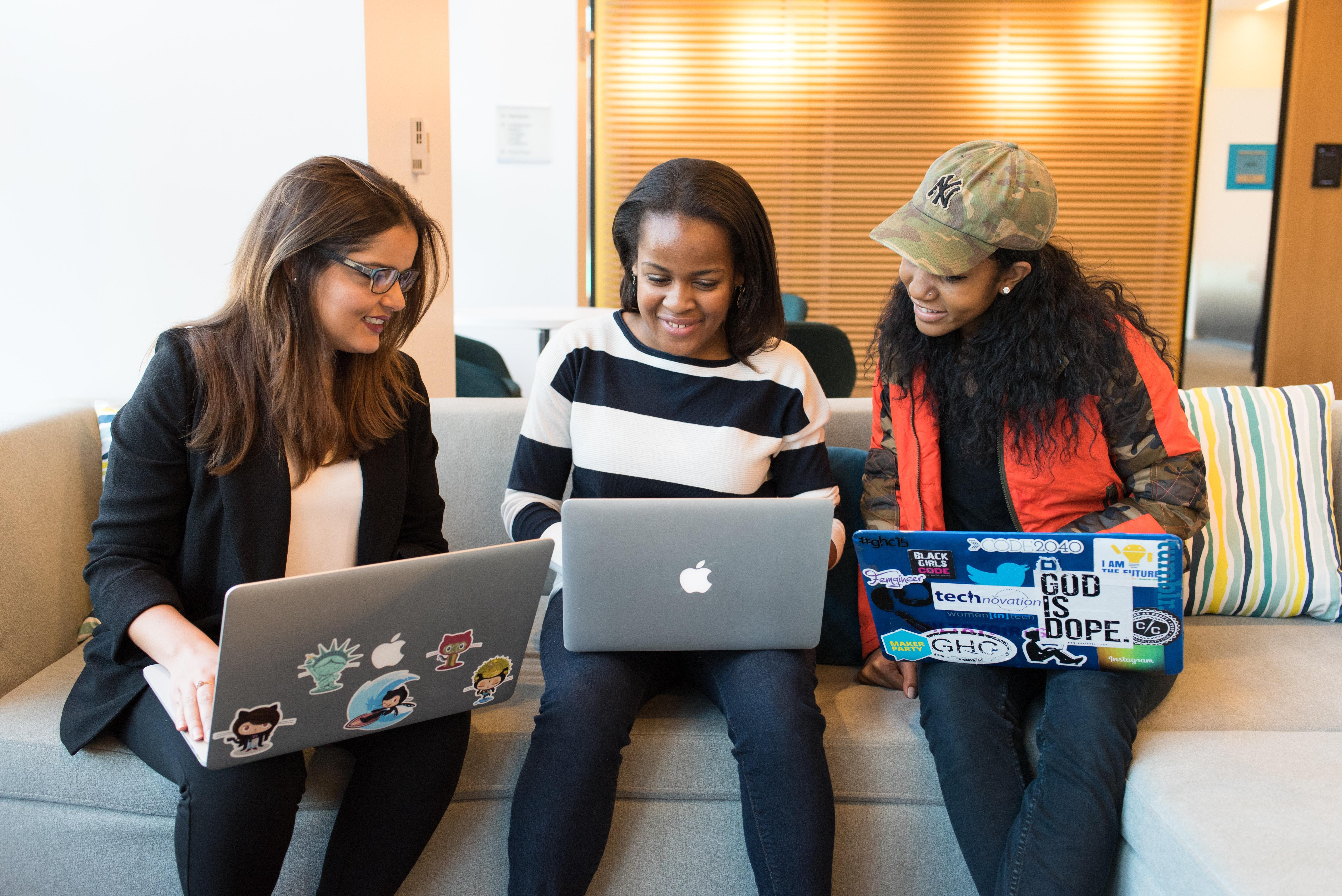 women with laptops learning