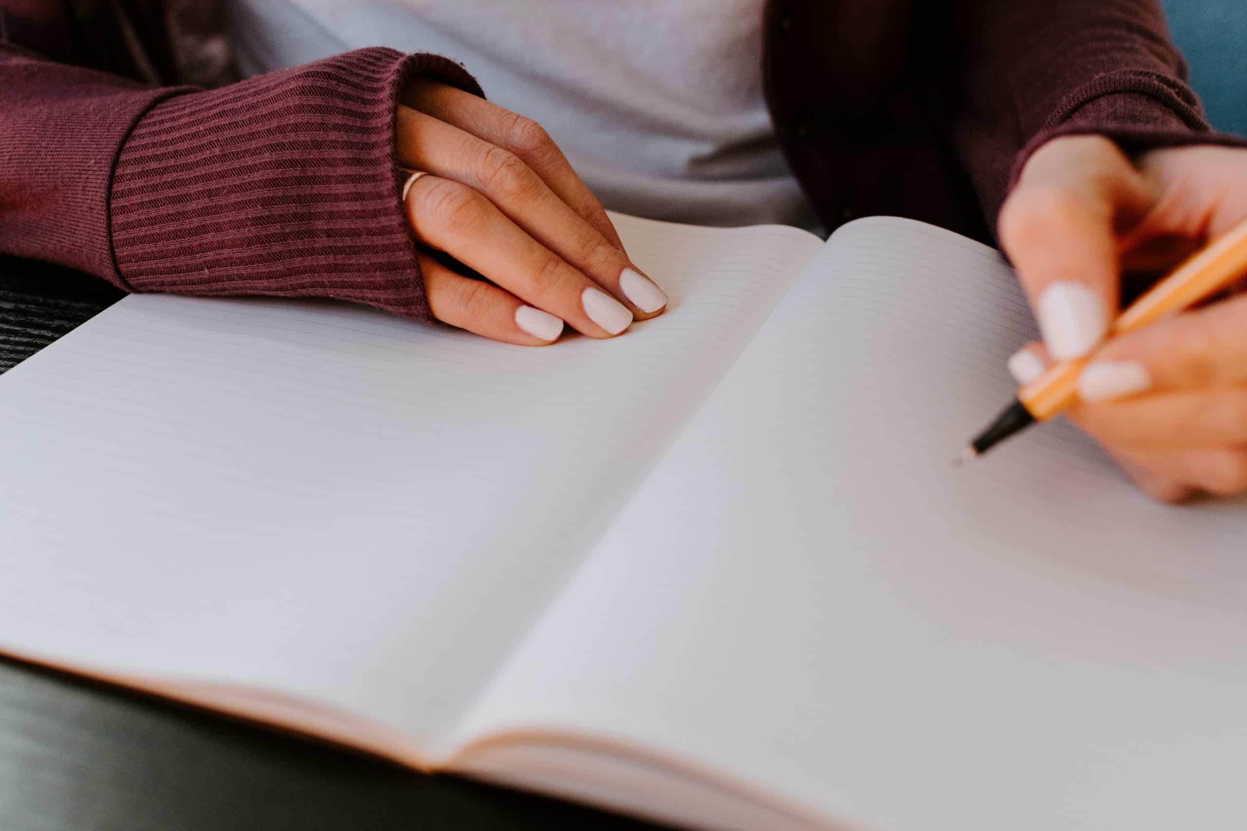 Woman writing in a journal