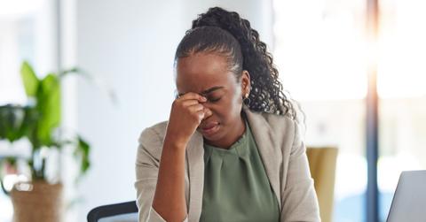 Crisis, stress and black woman with problem in office, sick or headache from brain fog. Frustrated, fatigue and African professional with business fail, mistake emoji or debt, bankruptcy or tax audit
