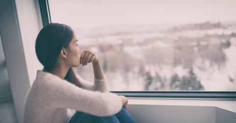 Depression, mental health, psychology therapy – mind wellness well being Asian girl with winter blues seasonal affective disorder feeling sad or heart broken with breakup alone. Loneliness, burnout , despair.