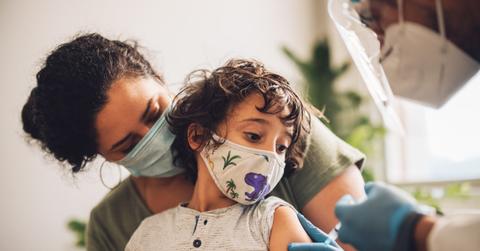 Kid receiving covid vaccine at home