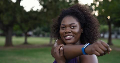 Smiling curvy woman stretching