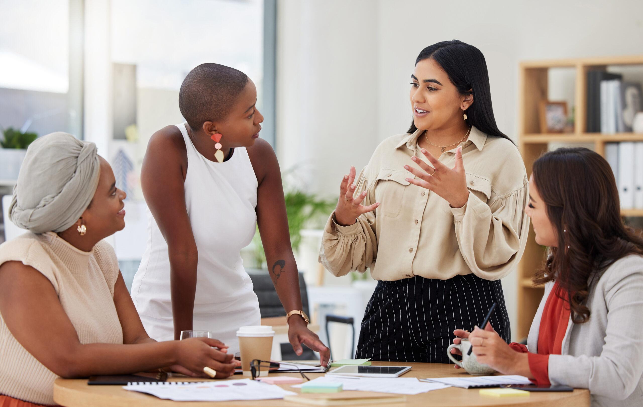 Diverse group, teamwork and young business women brainstorming, collaboration or cooperation. Ambitious confident professional team of colleagues talking and planning a marketing strategy together