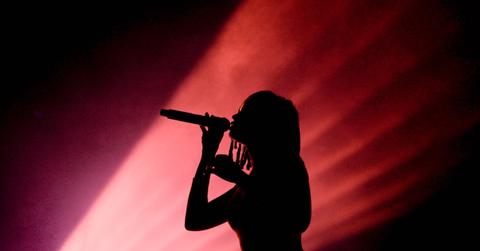 Silhouette of an unrecognizable female singer