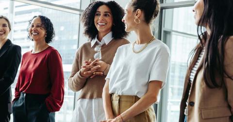 Group of businesswomen conversing during a conference at the office