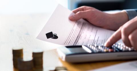 Man counting college savings fund, tuition fee or student loan w